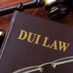DUI Law title on a book and gavel. DUI Law title on a book and gavel.