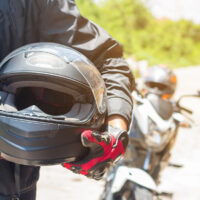 Man in a Motorcycle with helmet and gloves is an important protective clothing for motorcycling throttle control,safety concept