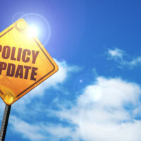 policy update road sign against beautiful sky background policy update road sign against beautiful sky background