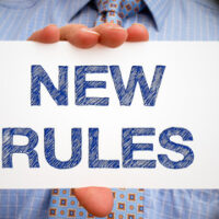 white sign that reads new rules white sign that reads new rules