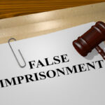 False imprisonment document with gavel on top False imprisonment document with gavel on top
